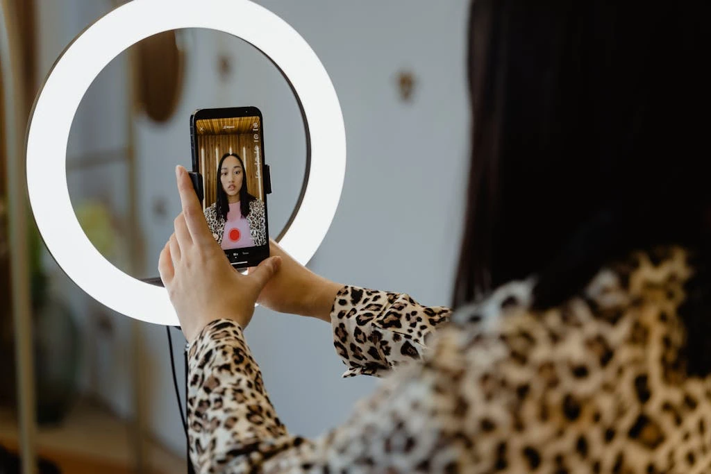 photo by mart production - digital marketing for growing businesses by honeypot marketing A Woman Using Smartphone and Ring Light