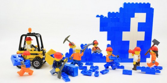 Facebook algorithm changes destroying business depicted by LEGO construction crew.