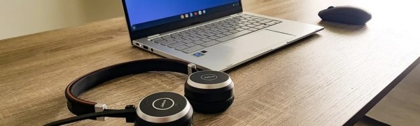 image of laptop and headphones on table