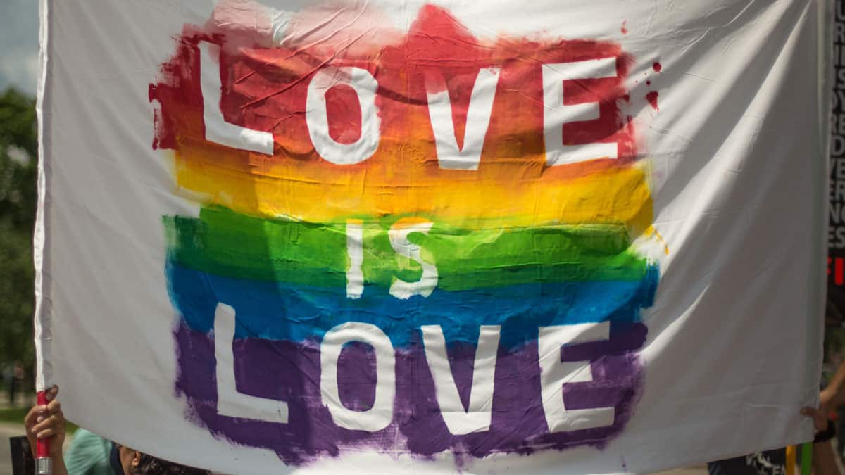 rainbow coloured love is love flag